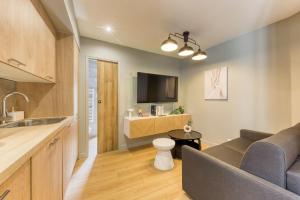 TV a/nebo společenská místnost v ubytování Duplex appartement Paris