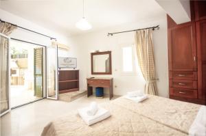 Voodi või voodid majutusasutuse Aphrodite Suites & Apartments with Swimming Pool toas