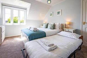 En eller flere senge i et værelse på Isis Lakes 52, Fountain View