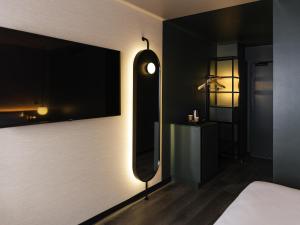 Postel nebo postele na pokoji v ubytování Novotel Paris Suresnes Longchamp