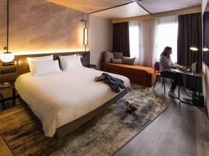 Postel nebo postele na pokoji v ubytování Novotel Paris Suresnes Longchamp