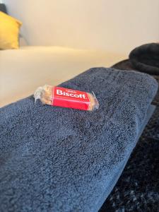 a discarded tube of toothpaste sitting on top of a bed at Cosy Flat Leeds City Centre in Central Station