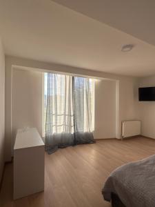 Ένα ή περισσότερα κρεβάτια σε δωμάτιο στο Hotel Palma