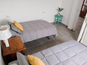 a living room with a couch and a table at Ático Sol & Mar - La Línea in La Línea de la Concepción
