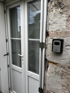 a door to a house with a mailbox next to it at Bulle D évidence in Saumur