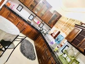 an overhead view of a kitchen with a table and chairs at PEONY luxury Homestay - Anuradhapura in Anuradhapura