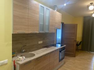 Kuchyň nebo kuchyňský kout v ubytování Appartament Karja 26A/10 + 35 fotografií