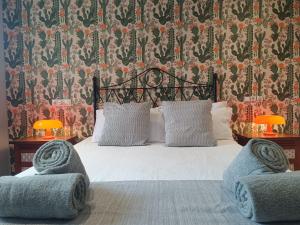 a bedroom with a white bed with two chairs at Torremar Natura 532 in Vera +37 photos