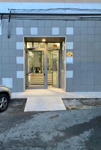an entrance to a building with a revolving door at L'ultima Luna Rooms in Termoli