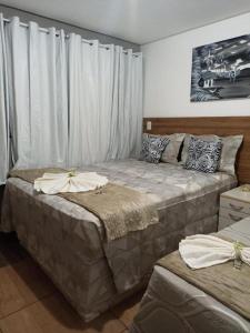 Ліжко або ліжка в номері Pousada Maceió é Massa