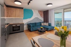 a living room with a couch and a table at Split For You - 2BR Apartment with Free Garage Parking in Split