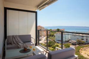 a room with a balcony with a view of the ocean at Split For You - 2BR Apartment with Free Garage Parking in Split