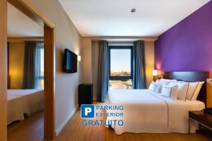 Posteľ alebo postele v izbe v ubytovaní Hotel Salamanca Montalvo