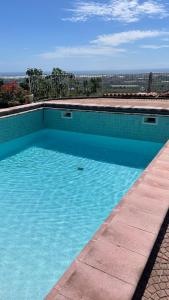 a large blue swimming pool with a view at BnB Panora Hill in Faiano