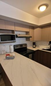 a kitchen with a marble counter top and a kitchen island at Take a rest nearest to Antigua Guatemala in Santa Lucía Milpas Altas +20 photos
