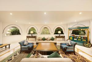 a living room with a couch and a table at Gateway Aurangabad - Chhatrapati Sambhaji Nagar in Aurangabad