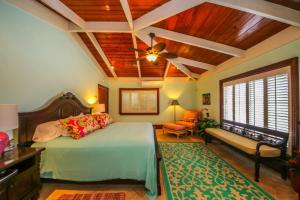 a bedroom with a bed and a ceiling fan at Shoys Beach House - 5 bedroom villa on the Beach! in Christiansted +26 photos