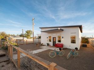 two bikes parked in front of a house at Welcome to the Milky Wayfarer in Marfa