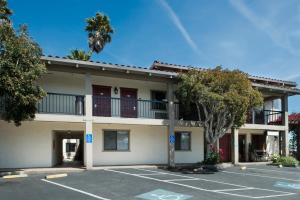 an empty parking lot in front of a building at Mission Inn in Santa Cruz