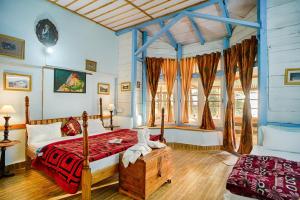 Voodi või voodid majutusasutuse Leela Cottages toas