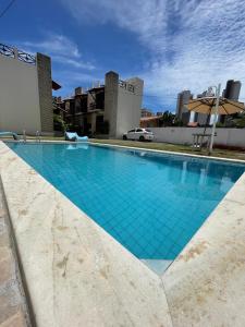 Kolam renang di atau dekat dengan Flatmarazul Lindos Apartamentos Privativo com cozinha