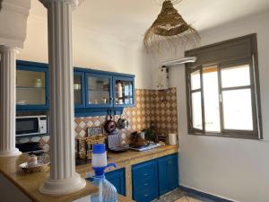 Kuchyň nebo kuchyňský kout v ubytování Mirleft Hostel + 13 fotografií