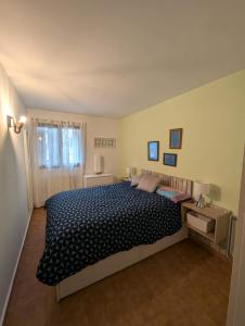 a bedroom with a large bed in a room at Casa espelunciecha in Biescas