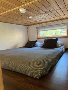 Postel nebo postele na pokoji v ubytování Tiny Village Latvia
