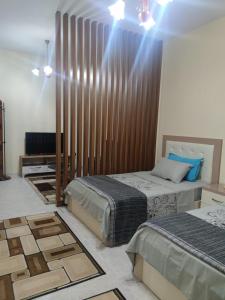 Postel nebo postele na pokoji v ubytování Ami guest house