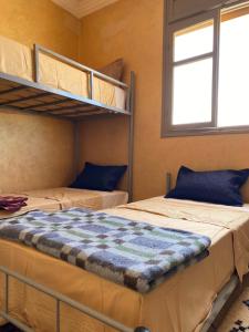 Postel nebo postele na pokoji v ubytování Mirleft Hostel