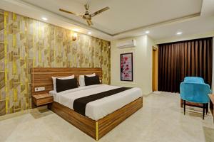 Postel nebo postele na pokoji v ubytování Hotel DSR TELA Plaza Near IGI Airport Delhi