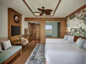Postel nebo postele na pokoji v ubytování Mövenpick Resort Phan Thiet