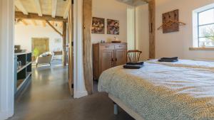 Postel nebo postele na pokoji v ubytování B&B Boerderij La Trappe Deurne