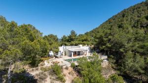 an aerial view of a house on a hill at Casa Amapola by Eivillas in Sant Josep de Sa Talaia