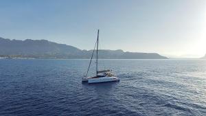 a small boat floating in a large body of water at Alion Yacht in Altea