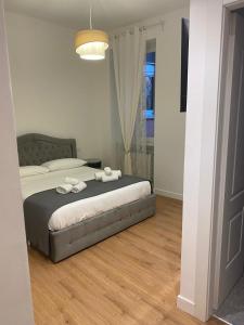 Ένα ή περισσότερα κρεβάτια σε δωμάτιο στο Harmony in Rome +13 φωτογραφίες