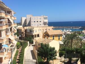 a view of a city with buildings and the ocean at Palasiet in Villajoyosa