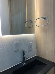 a bathroom with a sink and a mirror at A Hostel in Guadalajara