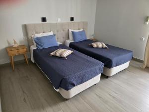 Postel nebo postele na pokoji v ubytování Mina Studios