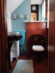 a bathroom with a toilet and a sink at Ca' del Bovolo in Chioggia