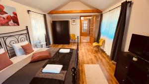 A television and/or entertainment centre at Strigonia Apartman