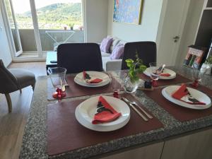 a table with plates of watermelons on top of it at Acogedor Depto Centro de Temuco in Temuco