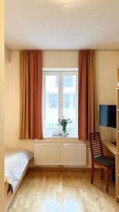 Televiisor ja/või meelelahutuskeskus majutusasutuses Gästezimmer Karolina