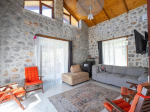 a living room with a couch and a chair at Sora no mori in Marmaris