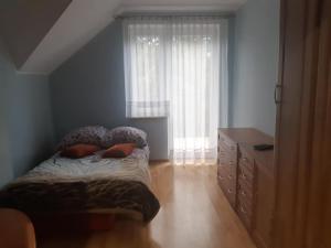 Łóżko lub łóżka w pokoju w obiekcie Willa Ola