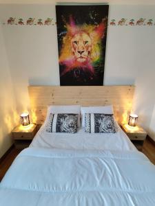 En eller flere senge i et værelse på Chez Nanou location saisonnière 2 chambres