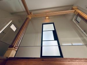 a window on the side of a building at Havenhuis TEXEL, per week or weeks Saturday-Saturday in Oudeschild