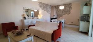 a living room with a couch and a table at Casa Clelia in Pula