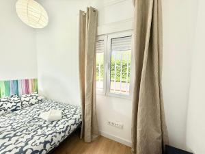 Łóżko lub łóżka w pokoju w obiekcie Aluche Aparment B