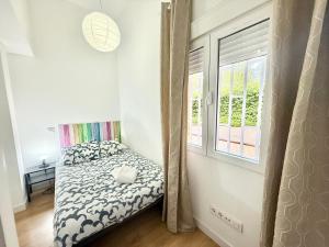 Łóżko lub łóżka w pokoju w obiekcie Aluche Aparment B